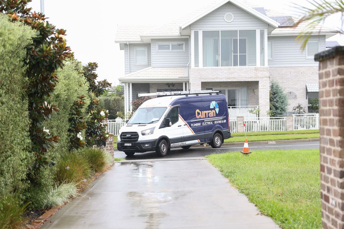 Curran service van arriving at a local home
